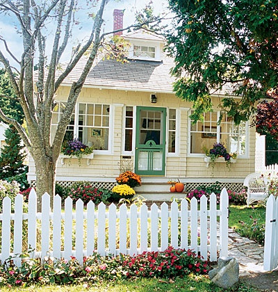 Landscaping your Front Yard Yellow house with picket fence